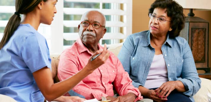 caregiver consulting the senior couple