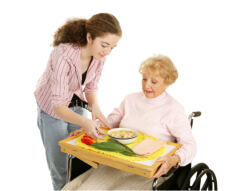 caregiver giving food to the senior